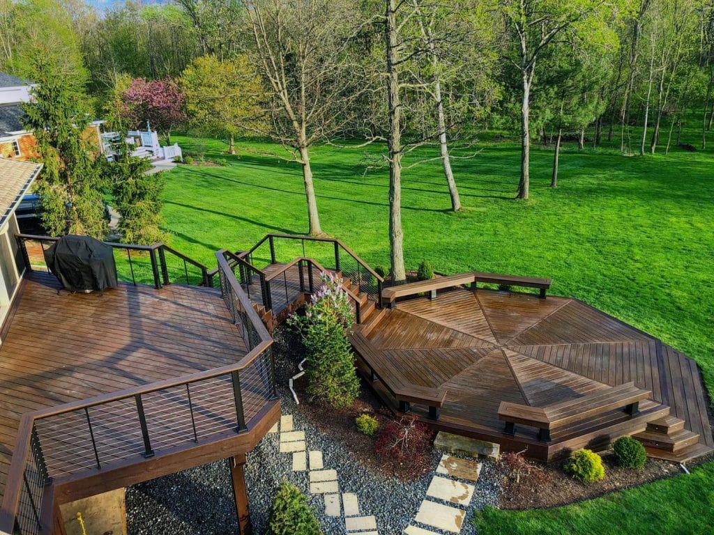 Home's backyard patio with staircases